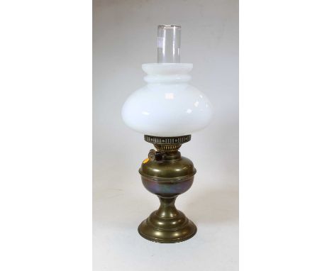 A 19th century brass oil lamp, with milk glass shade, h.46cm 