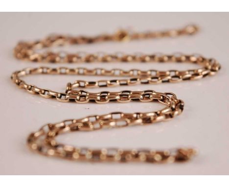 A yellow metal chain link guard chain, unmarked but tests as approx 9ct, 9g, length 74cmCondition report: Repair to link at t