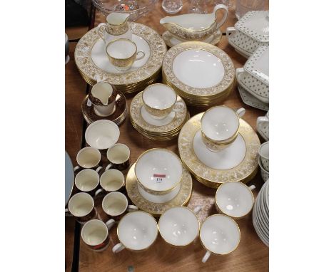 A Wedgwood bone china 8-place setting part tea and dinner service in the Gold Florentine pattern; together with a Crownford B