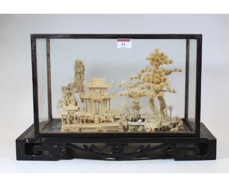 A 20th century Japanese carved cork model landscape, in a glazed display case, h.28cm 