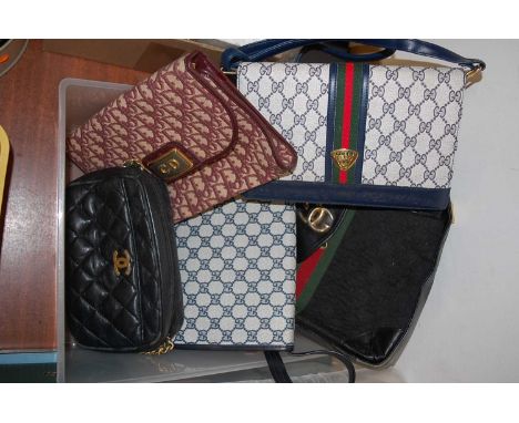 A lady's blue leather handbag, bearing label for Gucci; together with various other lady's handbags