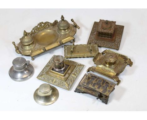 A Victorian style brass desk stand having a raised pierced back with twin inkwells, and pen holder, width 28cm; together with