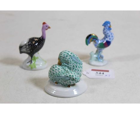 A Herend hand-painted porcelain model of two juvenile rabbits, having printed mark verso; together with a Herend cockerel; an