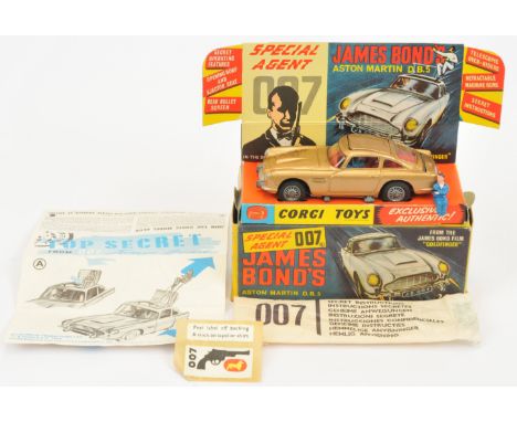 Corgi Toys 261 "James Bond" Aston Martin DB5 Taken from "Goldfinger" - Gold body, red interior with "James Bond &amp; Bandit"