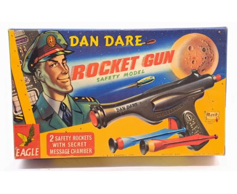 Merit (UK) "Dan Dare Rocket Gun" (safety model), brown plastic construction, made to fire plastic darts, comes with 2 darts f