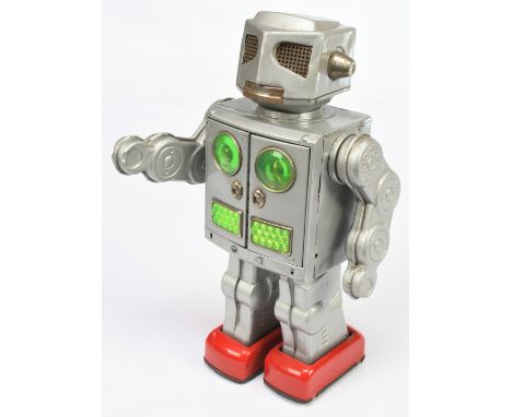 SH Toys (Horikawa of Japan) "Attacking Martian" tinplate Robot, circa 1960s, silver with red feet, chest opens to reveals two