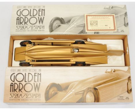 Schylling Collector Series Golden Arrow tinplate clockwork model of the 1929 Landspeed Record Car, metallic gold finish, stee