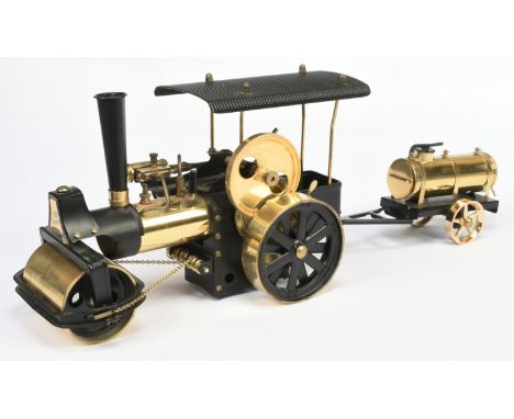 Wilesco "Old Smokey" Steam Roller Traction Engine, has not been fired, gold and black colouring, with trailer, light surface 