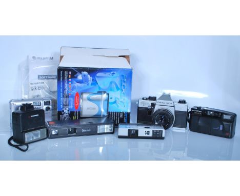 A collection of vintage cameras to include a Praktica PM3 film camera fitted with a domiplan automatic lens 2.8/50, Olympus T