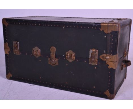 An early 20th century American fitted steamer trunk - travel chestl The hard body with bracket work and clasps enclosing a fu