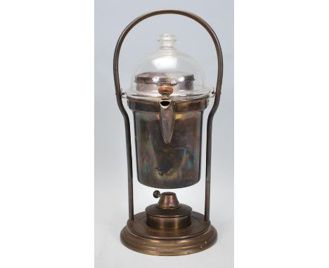 A vintage early 20th Century coffee spirit kettle of cylindrical brass construction having a glass cover with heater below. M