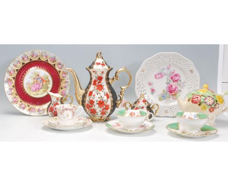 A mixed group of ceramics dating from the late 19th Century to include a "Nouvelle" Atlas China trio with floral and butterfl