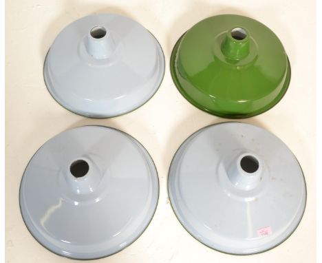 A set of four&nbsp;UFO enamel industrial ceiling lamp / light shades one finished in green with three in a light blue colourw