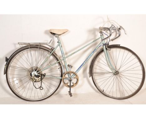 A vintage retro 20th Century racing / road bike / bicycle by Peugeot having original fittings and good original paintwork wit
