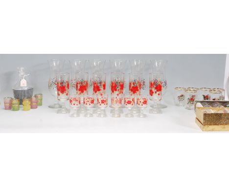 A mixed collection of vintage retro 20th Century drinking glasses of various sizes to include a boxed set of shot glasses dec