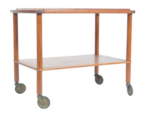 An original 1960's retro vintage teak wood cocktail serving trolley comprising of two tiers raised on cylindrical legs over l