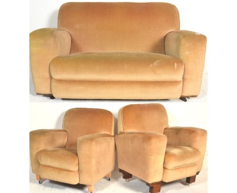 A 1930's Art Deco three piece suite comprising pair of armchairs and a two seat sofa settee being upholstered in a yellow vel