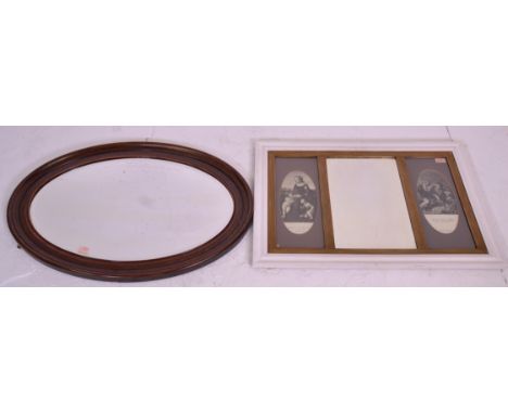 A vintage 20th Century white painted pine framed mirror of rectangular form having an inner giltwood border with a central be