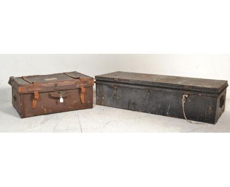 A vintage late 19th / early 20th Century military tin steamer trunk, hinged top with lock to front. The trunk with notation t
