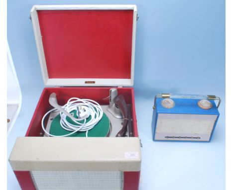 A vintage retro 20th Century two tone portable Falcon made record player having a BSR turntable. The case finished in&nbsp; r