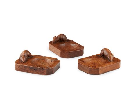 ROBERT 'MOUSEMAN' THOMPSON (1876-1955) GROUP OF THREE ASHTRAYS, CIRCA 1930S-40S oak, each with a carved mouse signature, 10cm