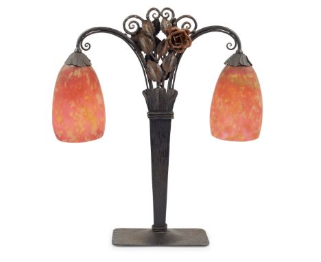 DAUM FRÈRES, NANCY, MANNER OF EDGAR BRANDT ART NOUVEAU TABLE LAMP, CIRCA 1925 cast iron, with mottled red glass shades, the s