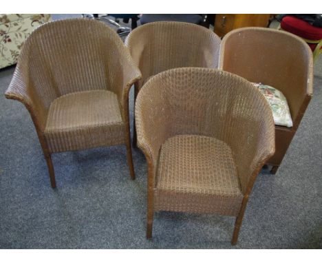 Three Lloyd Loom tub chairs, brown painted; a similar commode chair (4)