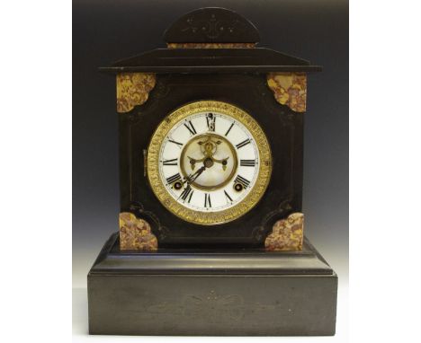 A 19th century belge noir mantel clock, rouge marble spandrels, engraved to base, enamel dial, Roman numerals striking on a g