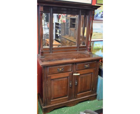 An early 20th century mahogany mirror back sideboard, moulded cornice above a trio of mirrors, the centre plate bevelled, sup