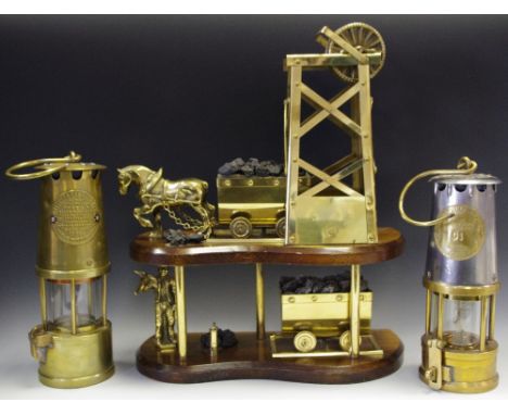 Mining Interest - a two tier brass and mahogany coal mining model; a near pair of Protector lamps, another smaller (4)