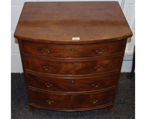 A George III mahogany bow front chest of small proportions four cockbeaded graduated drawer brass swing handles splayed brack