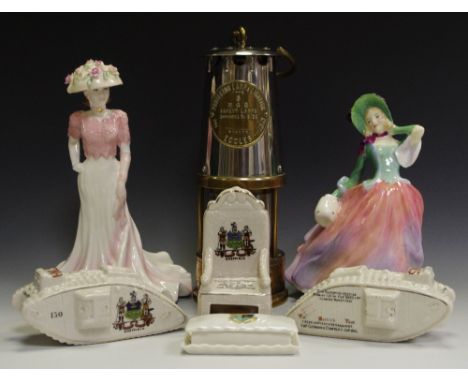 A Royal Doulton figure Autumn Breezes HN1911; a Coalport Ladies of Fashion Liz; Carlton crested ware - two WWI tanks marked S