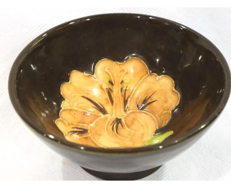 Small Moorcroft brown ground deep footed bowl in the Hibiscus pattern, D: 90 mm. No cracks, chips or visible restoration. P&a