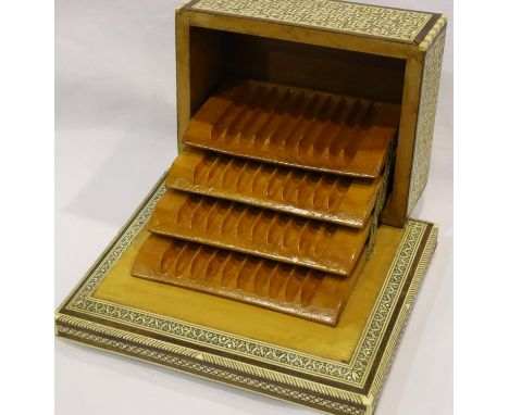 Mid 20th century metamorphic cigarette box with mother of pearl, brass and abalone inlays, lacking one foot, 20 x 16 x 10 cm 