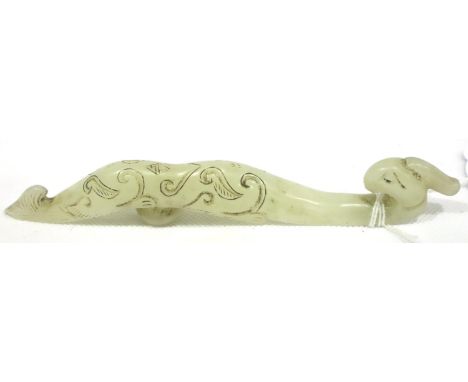 Chinese carved mutton fat jade shoulder buckle in the form of a phoenix, L: 16 cm. P&amp;P Group 1 (£14+VAT for the first lot