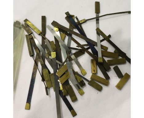 Quantity of replacement long case clock pendulum feathers. P&amp;P Group 1 (£14+VAT for the first lot and £1+VAT for subseque