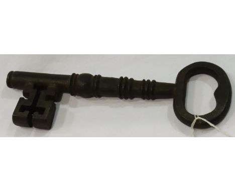 Large cast iron key, L: 25 cm. P&amp;P Group 2 (£18+VAT for the first lot and £3+VAT for subsequent lots) 