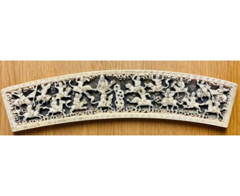 Curved ivory panel showing fighting warriors seated on horses, elephants and tigers, L: 24 cm. P&amp;P Group 1 (£14+VAT for t