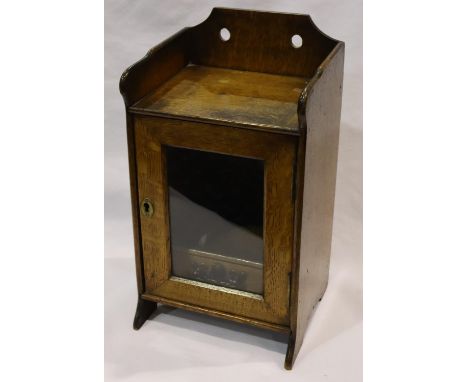 Early 20th century walnut single door smokers cabinet with single internal draw, 18 x 15 x 33 cm H. P&amp;P Group 3 (£25+VAT 