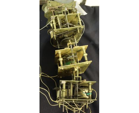 Four long case clock movements all with replacement cable barrels. Not available for in-house P&amp;P, contact Paul O'Hea at 