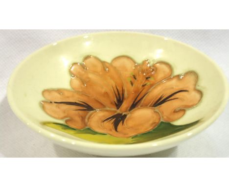 Moorcroft circular cream ground footed bowl in the Hibiscus pattern, D: 95 mm, no cracks, chips or visible restoration. P&amp