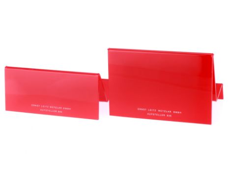 A Pair of Leica Camera Display Stands, red, VG, one branded "Leitz", the other "Leica".