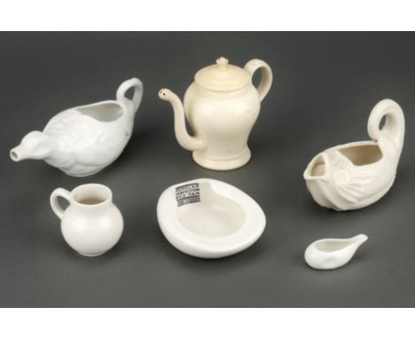 Collection of Medical Ceramics, including a creamwear feeding cup in the form of a classical dolphin, another in the form of 
