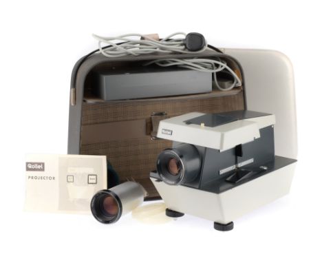 A Rollei Medium Format Slide Projector, Powers up, light illuminates, slide changer operates, with case, remote and instructi