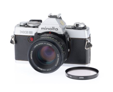 A Minolta XG 2 35mm SLR Camera, chrome, body G, battery check not working with new batteries, shutter not working, with MD Ro