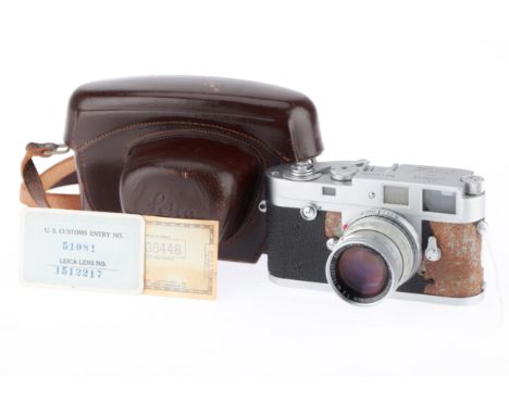 A Leica M2 Rangefinder Camera, 1958, chrome, serial no. 938446, with Leitz Summicron f/2 50mm lens, chrome, serial no. 151221