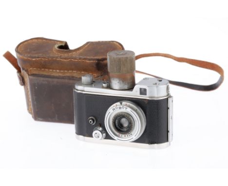 A Robot II 35mm Camera, chrome, serial number B37636-5, with double spring, body F, brassing to spring tower, minor dents to 