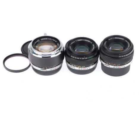 A Group of Olympus OM Lenses, comprising a Zuiko f/1.8 50mm, barrel G, optics G with dust, a second Zuiko f/1.8 50mm, barrel 