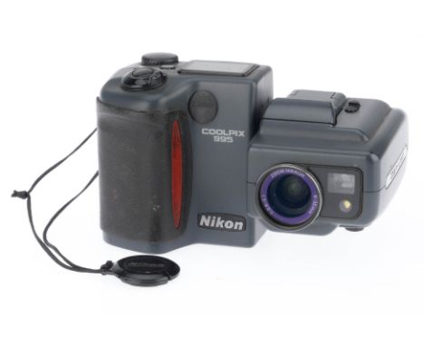 A Nikon Coolpix 995 Digital Camera, grey, serial number 4037759, body F-G, light marks to LCD glass, with lens cap and batter