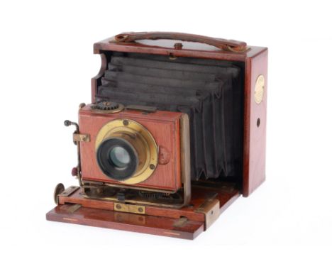 A J. Lizars "Challenge" Hand and Stand Camera, mahogany and brass, opens and folds correctly, bellows appear good, no obvious